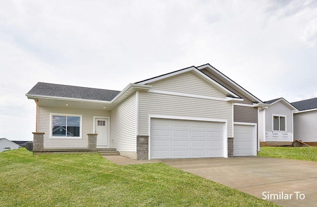 view of front of property featuring a garage, a front lawn, and central air condition unit