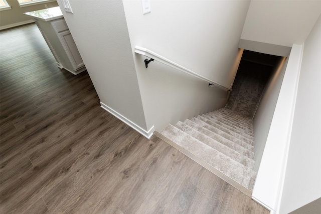 1099 NE 64th Ave, Des Moines, IA 50313 - stairway featuring wood finished floors