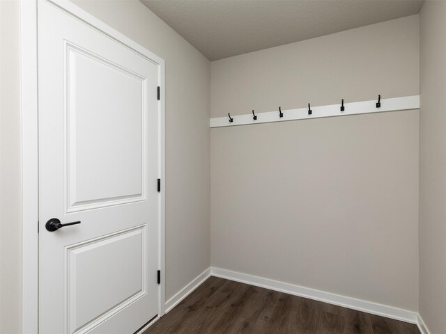 1099 NE 64th Ave, Des Moines, IA 50313 - mudroom featuring dark wood-style flooring and baseboards