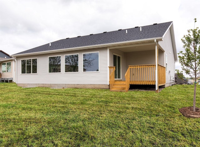 1099 NE 64th Ave, Des Moines, IA 50313 - back of property featuring a deck, a yard, and roof with shingles