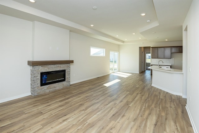 unfurnished living room with light wood-style flooring and recessed lighting