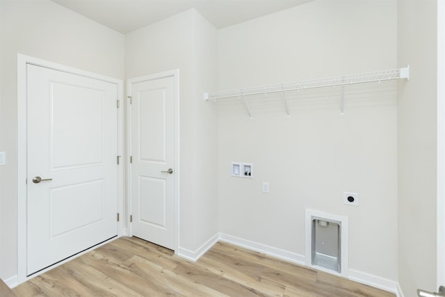 washroom with electric dryer hookup, light wood-style floors, baseboards, laundry area, and washer hookup