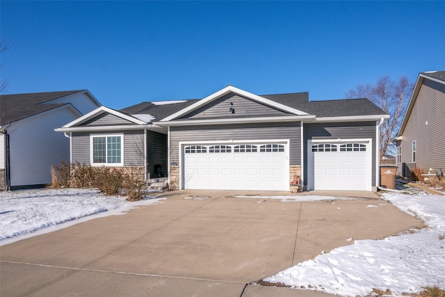 view of front of property featuring central AC unit and a garage