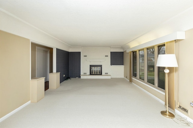 unfurnished living room with light carpet and a fireplace