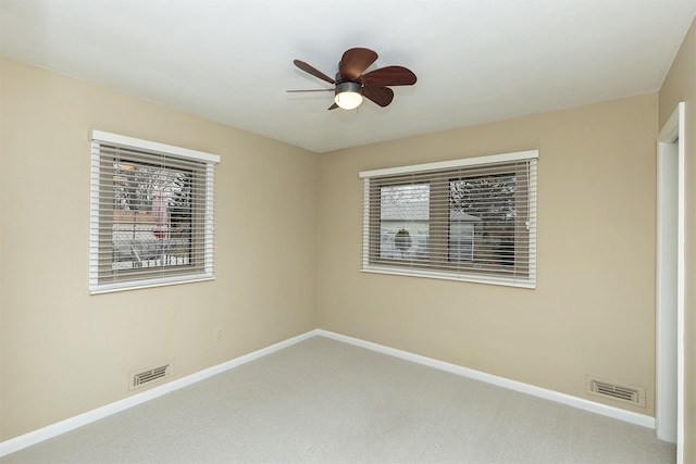 empty room with carpet and ceiling fan