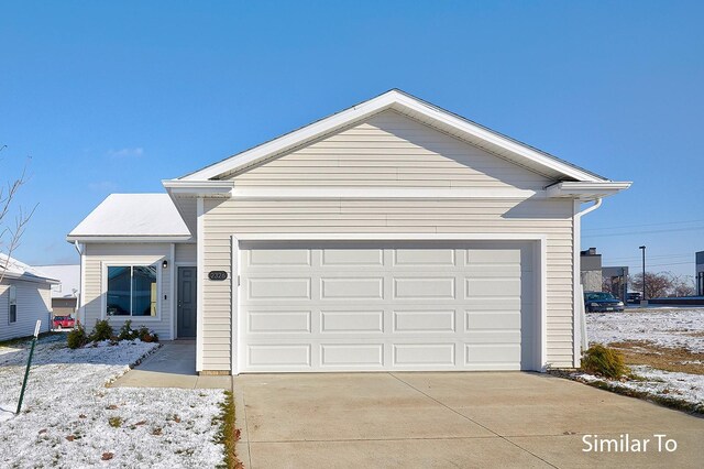 ranch-style home featuring a garage