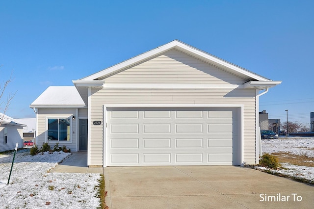 single story home featuring an attached garage and concrete driveway