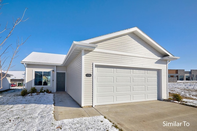 ranch-style home featuring a garage