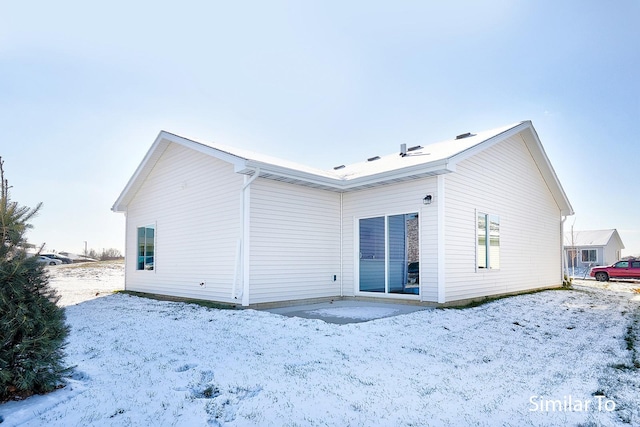 view of snow covered property