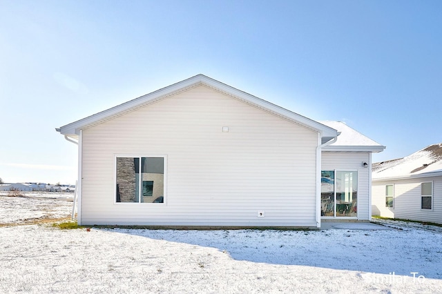 view of snow covered house