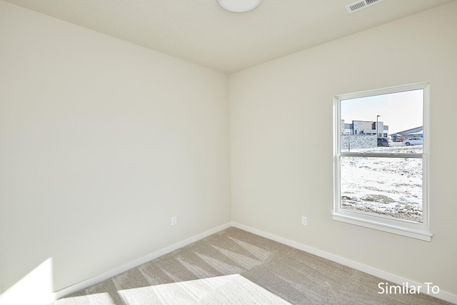 view of carpeted spare room