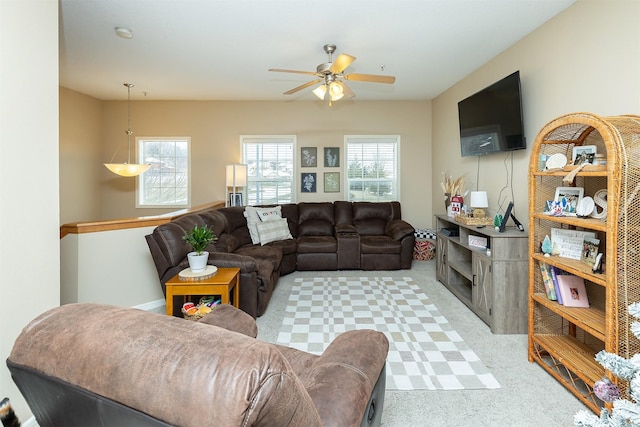 living room featuring light colored carpet and ceiling fan