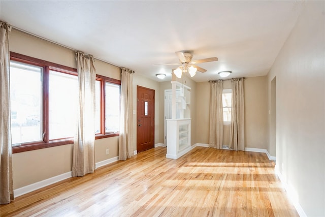 spare room with light hardwood / wood-style flooring and ceiling fan