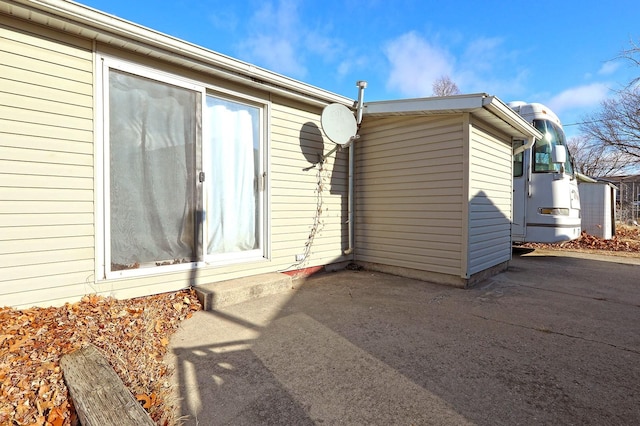 entrance to property featuring a patio