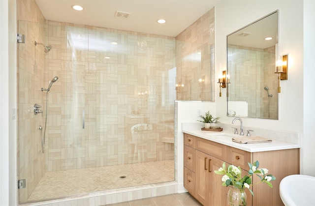 bathroom featuring visible vents, tile patterned flooring, vanity, a shower stall, and recessed lighting