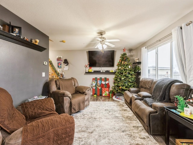 living room with hardwood / wood-style flooring and ceiling fan