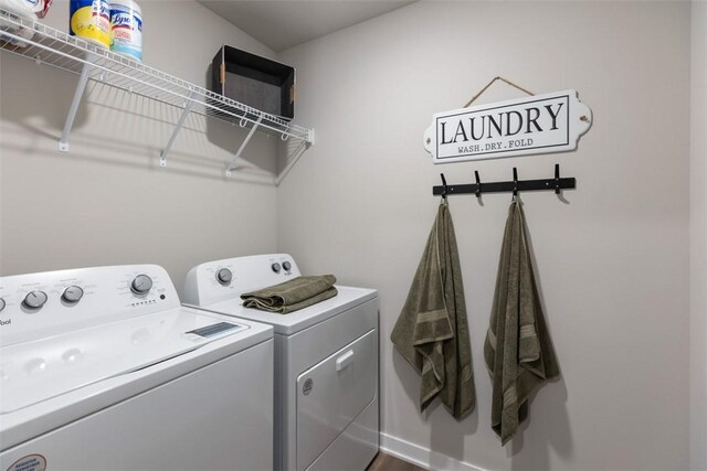 4408 NE 11th St, Ankeny, IA 50021 - washroom featuring washing machine and dryer and baseboards