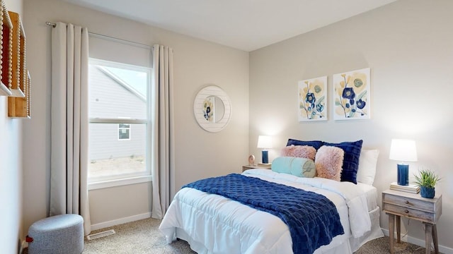 bedroom featuring light carpet