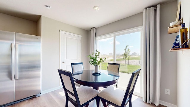 1161 Magnolia Ln, Waukee, IA 50263 - dining room with light wood finished floors and baseboards