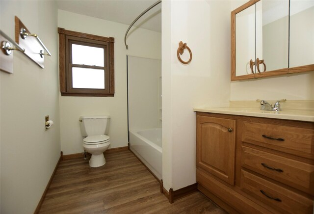 full bathroom with vanity, shower / bathtub combination, toilet, and wood-type flooring