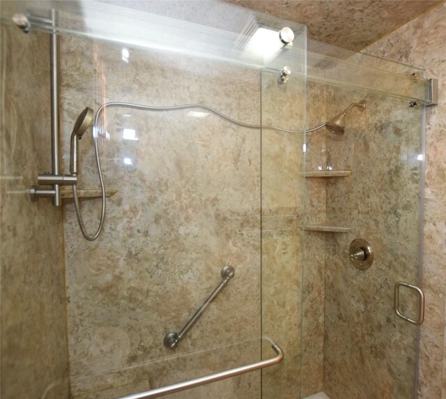 bathroom featuring an enclosed shower