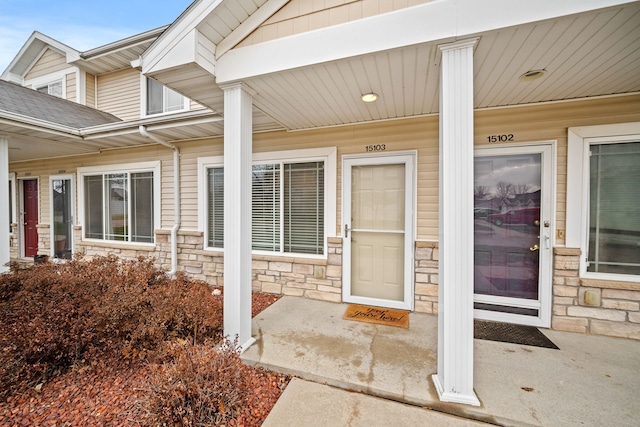 view of exterior entry featuring a porch