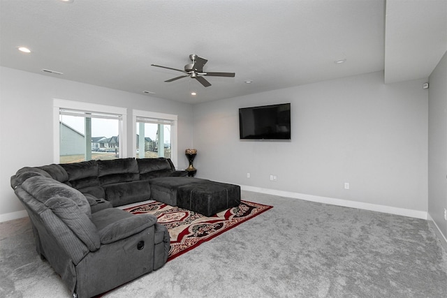 carpeted living room featuring ceiling fan