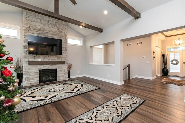 living room featuring a fireplace, dark hardwood / wood-style flooring, and lofted ceiling with beams