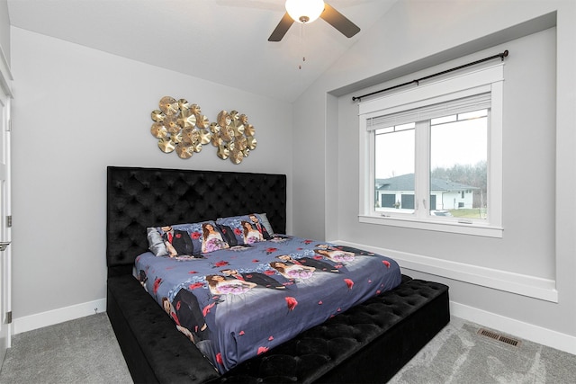 bedroom with ceiling fan, carpet floors, and vaulted ceiling