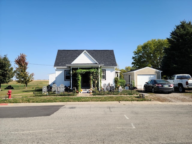 bungalow-style home with an outbuilding and a garage