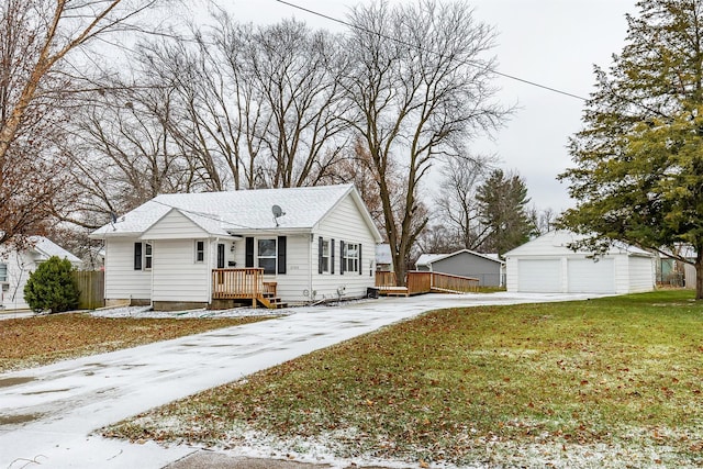 view of front of house with an outbuilding, a front yard, and a garage