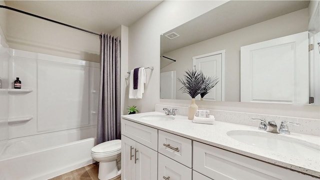 full bathroom featuring toilet, shower / bath combination with curtain, hardwood / wood-style floors, and vanity