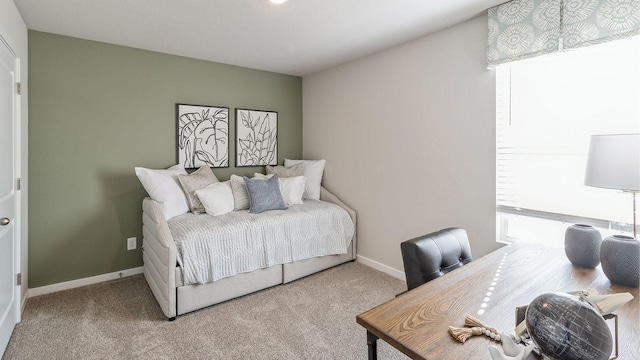 carpeted bedroom with baseboards