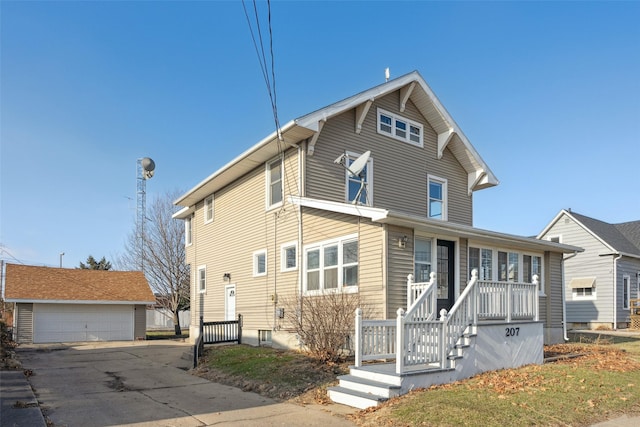 view of front property featuring a garage and an outdoor structure