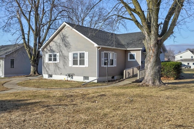 rear view of house with a yard