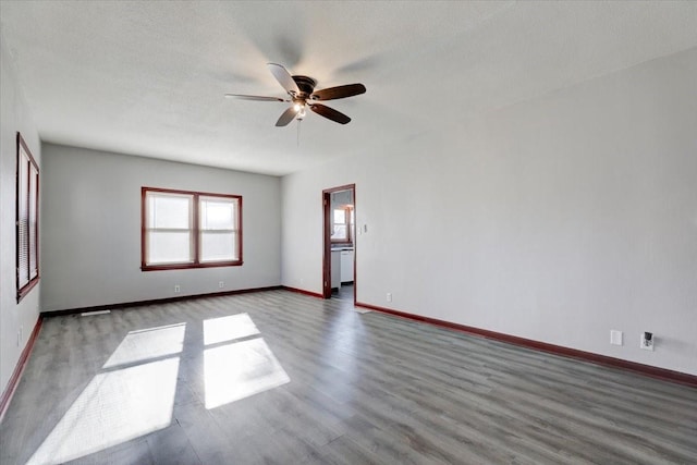 spare room with hardwood / wood-style floors, ceiling fan, and a textured ceiling