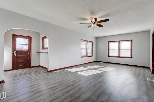 entrance foyer featuring ceiling fan, wood-type flooring, and a textured ceiling