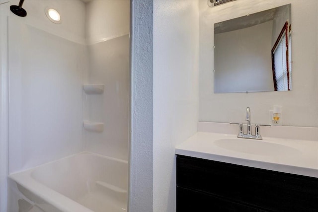 bathroom with vanity and tub / shower combination