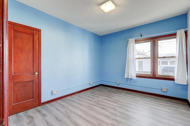 unfurnished room featuring light hardwood / wood-style floors