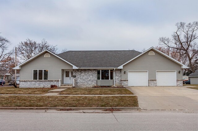 ranch-style house featuring a garage