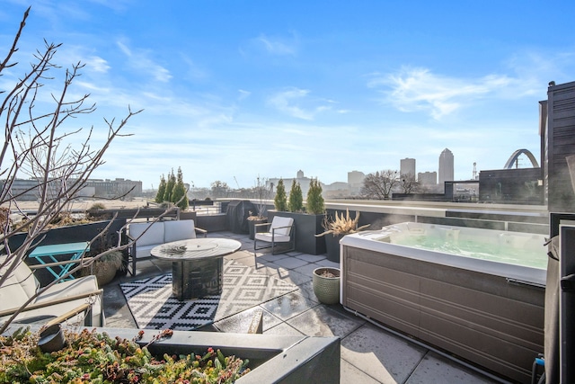 view of patio / terrace featuring a hot tub