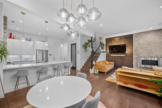 dining space featuring dark hardwood / wood-style floors