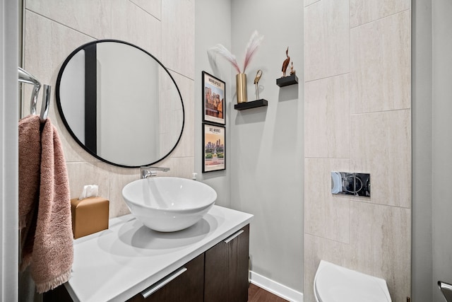 bathroom featuring vanity and toilet