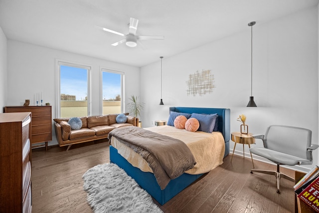 bedroom with ceiling fan and hardwood / wood-style flooring