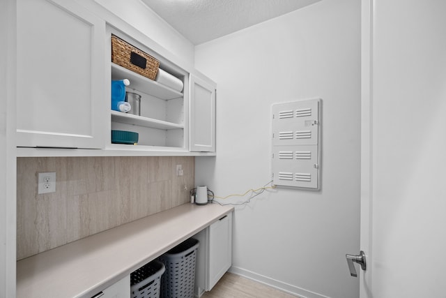 laundry room with a textured ceiling