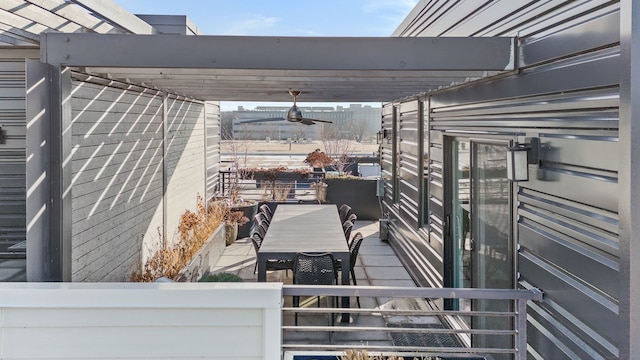 wooden terrace with a pergola and ceiling fan