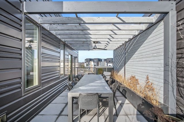 view of patio featuring ceiling fan