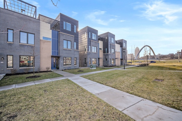 view of home's community featuring a lawn