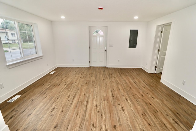 entrance foyer featuring light wood-type flooring and electric panel