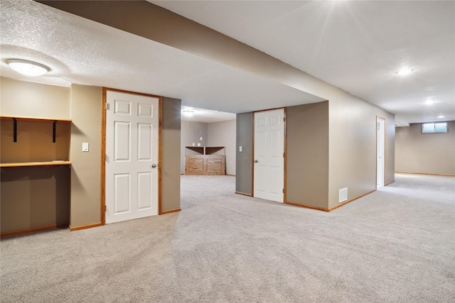 basement with carpet flooring